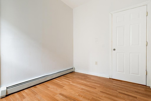 268 Bergen Ave, Jersey City, NJ 07305 - unfurnished room with a baseboard heating unit and light wood finished floors