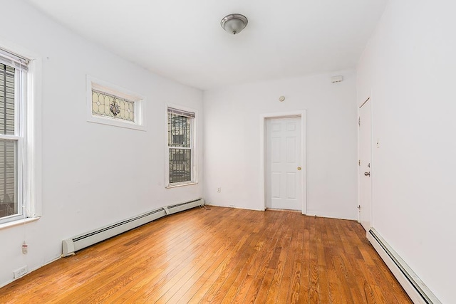 268 Bergen Ave, Jersey City, NJ 07305 - unfurnished room featuring baseboard heating and hardwood / wood-style flooring