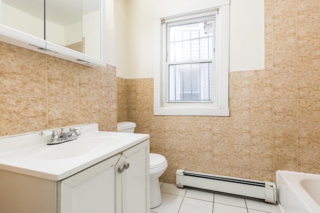 268 Bergen Ave, Jersey City, NJ 07305 - full bathroom featuring baseboard heating, toilet, tile walls, vanity, and a tub to relax in