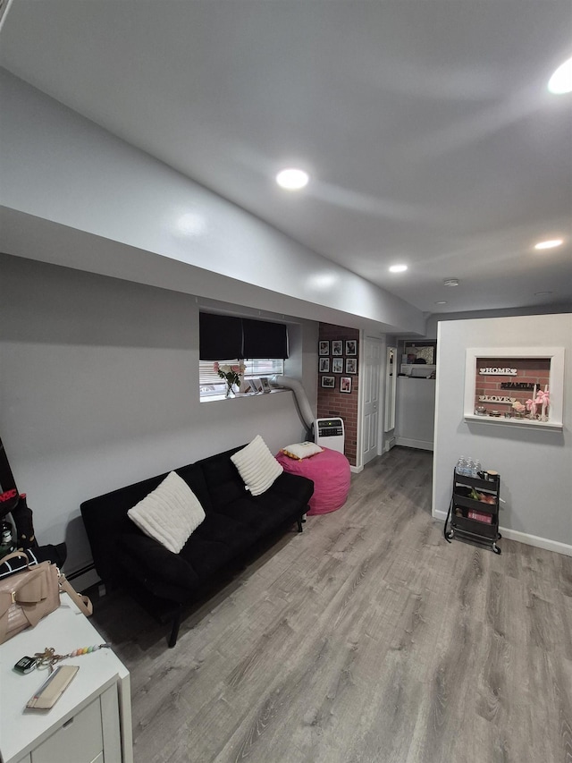 1200 Central Ave Unit B2, Union City, NJ 07087 - living area with wood finished floors, recessed lighting, and a baseboard heating unit