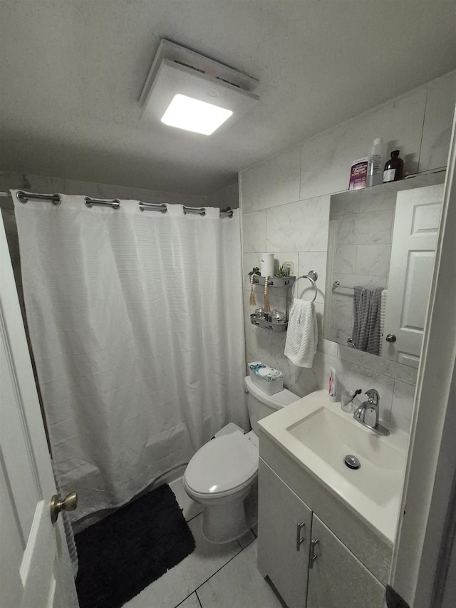 1200 Central Ave Unit B2, Union City, NJ 07087 - full bathroom with vanity, tile walls, a shower with shower curtain, and tasteful backsplash