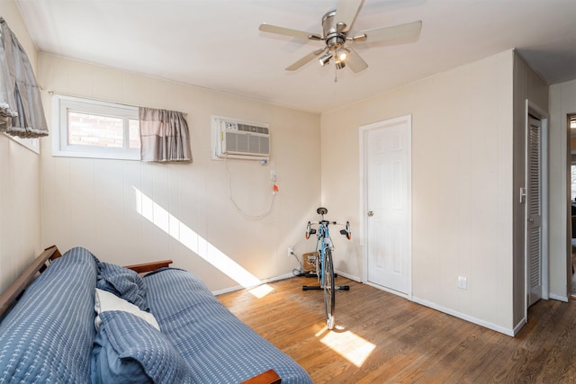 104 W 52nd St, Bayonne, NJ 07002 - interior space with ceiling fan, baseboards, wood finished floors, and a wall unit AC