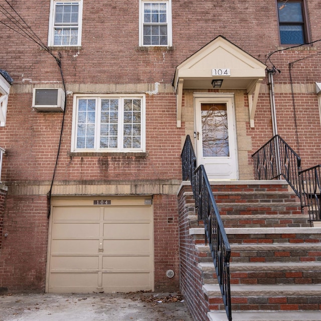 104 W 52nd St, Bayonne, NJ 07002 - property entrance with brick siding and a garage