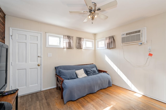 104 W 52nd St, Bayonne, NJ 07002 - bedroom with wood finished floors, a wall unit AC, and ceiling fan