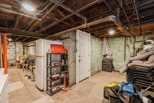 104 W 52nd St, Bayonne, NJ 07002 - unfinished basement with freestanding refrigerator