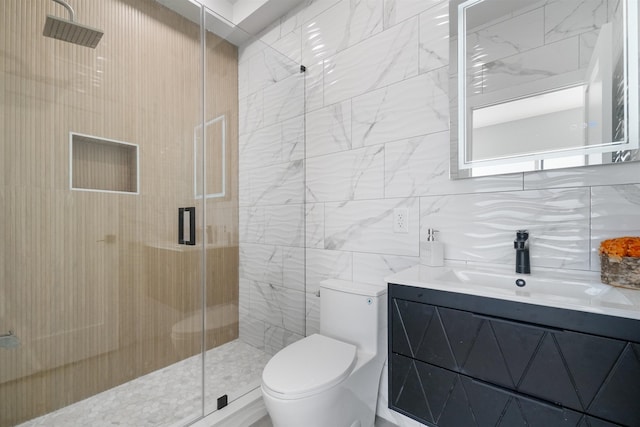 bathroom featuring toilet, an enclosed shower, tasteful backsplash, tile walls, and vanity