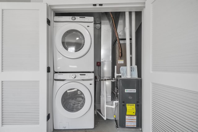 laundry room with stacked washer / drying machine