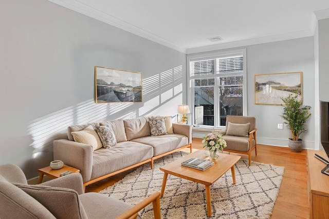 living room with ornamental molding and hardwood / wood-style flooring