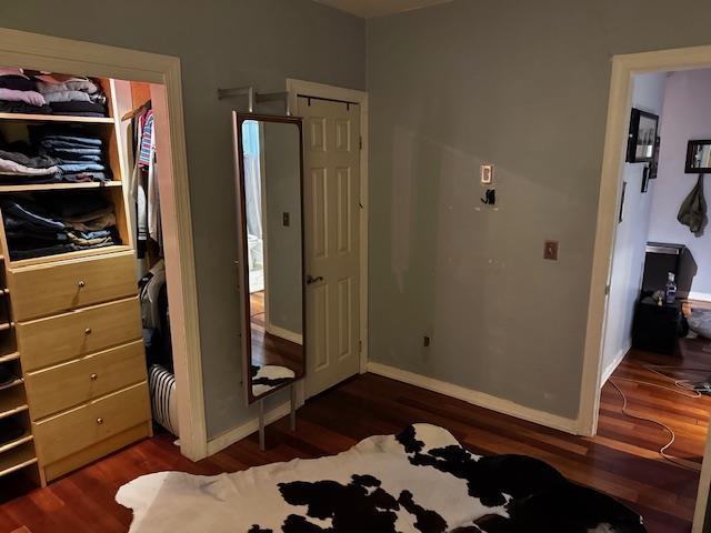 108 Waldo Ave Unit 4A, Jersey City, NJ 07306 - bedroom with dark wood-style floors