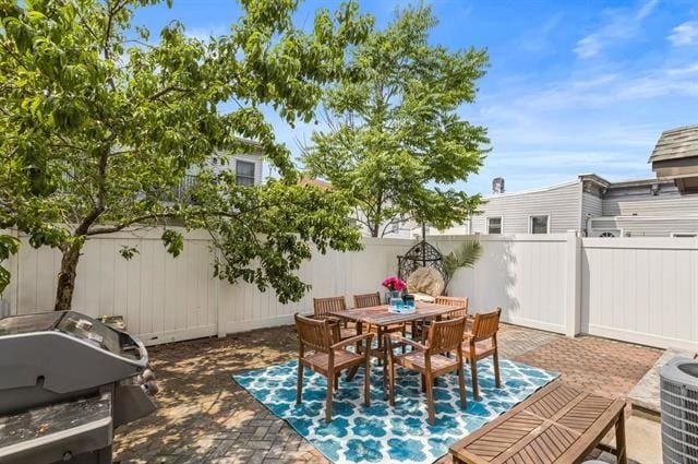 15 Nelson Ave Unit 1, Jersey City, NJ 07307 - fenced backyard with a patio area, area for grilling, and outdoor dining space