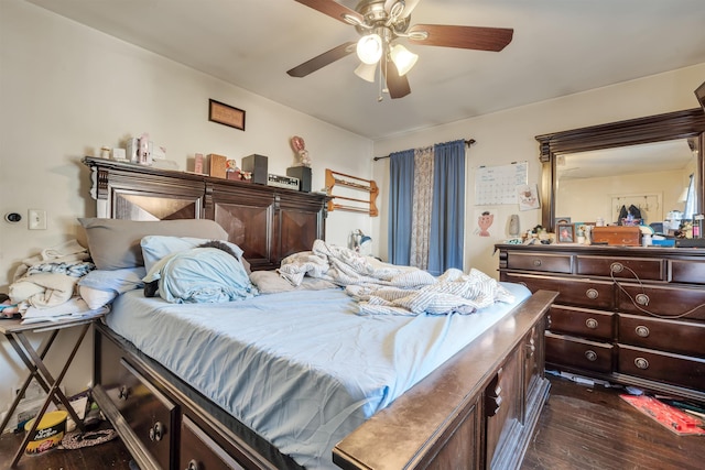 bedroom featuring ceiling fan and dark wood finished floors