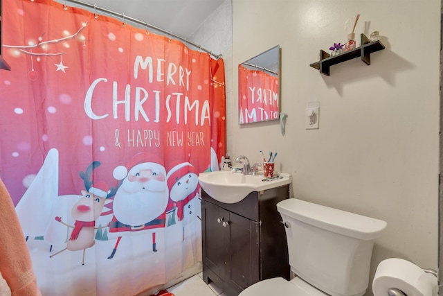 bathroom with vanity, toilet, and a shower with curtain