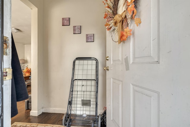 room details featuring baseboards and wood finished floors