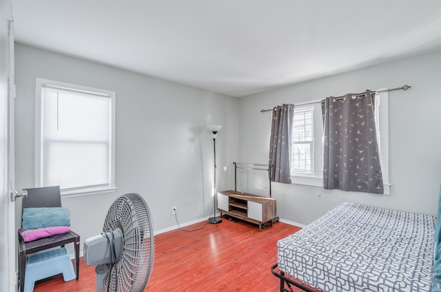 bedroom with hardwood / wood-style floors