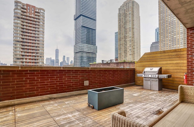 389 Washington St Unit 30C, Jersey City, NJ 07302 - view of patio with a skyline view and a grill
