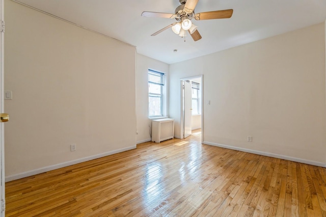 31 75th St Unit 9, North Bergen, NJ 07047 - unfurnished room with radiator, light wood-style floors, and a ceiling fan