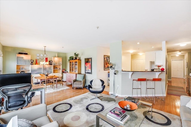 252 The Promenade Unit 252, Edgewater, NJ 07020 - living area featuring light wood-style flooring and recessed lighting