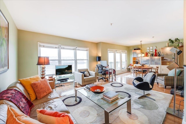 252 The Promenade Unit 252, Edgewater, NJ 07020 - living area featuring light wood-type flooring and french doors