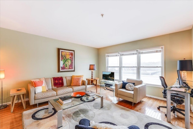 252 The Promenade Unit 252, Edgewater, NJ 07020 - living area with light wood finished floors and a desk