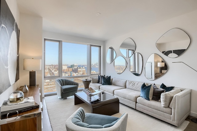 living room featuring light carpet and a city view