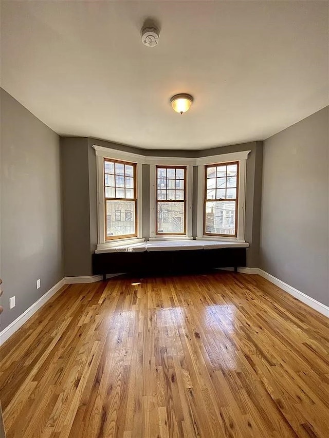 152 Highland Ave Unit 2B, Jersey City, NJ 07306 - spare room with plenty of natural light, wood finished floors, and a smoke detector