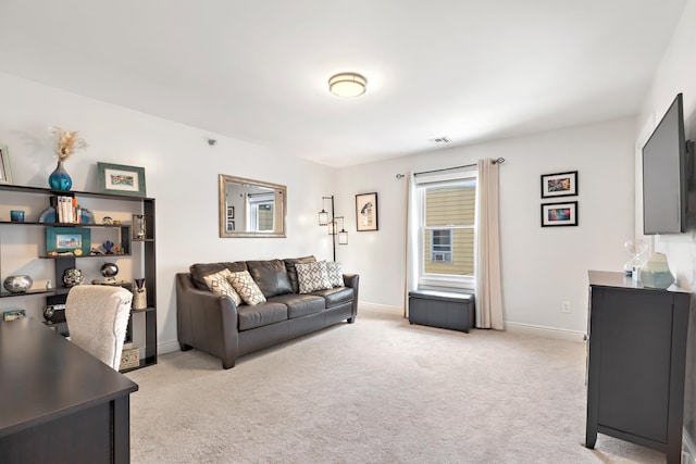 living room with light colored carpet, visible vents, and baseboards