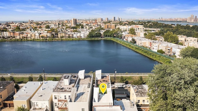 bird's eye view featuring a water view and a city view