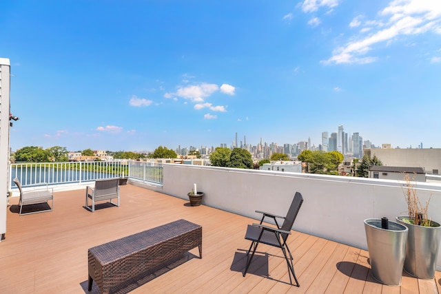 wooden terrace featuring a view of city