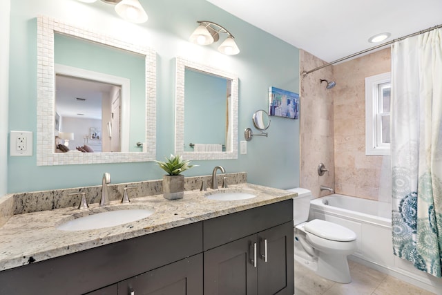 full bathroom featuring double vanity, a sink, toilet, and shower / tub combo with curtain