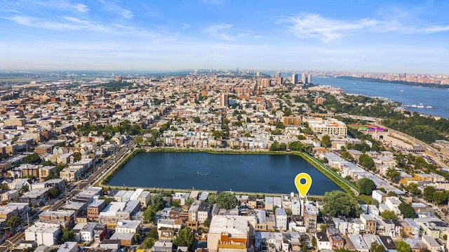 birds eye view of property with a water view