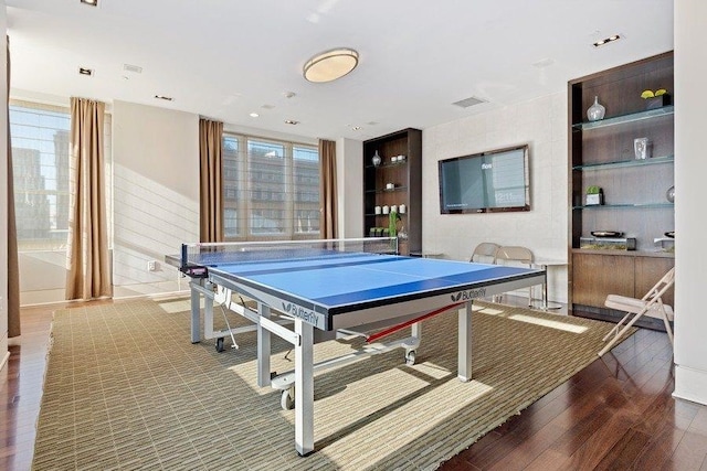 recreation room with visible vents and wood finished floors