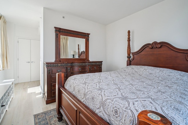 bedroom featuring light wood-style flooring