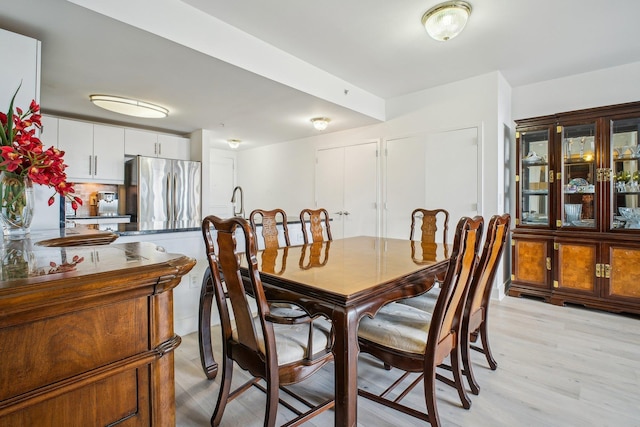 dining room featuring light wood finished floors