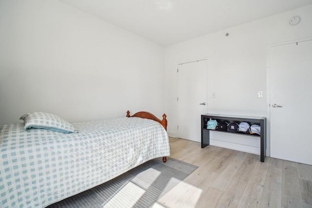 bedroom with light wood finished floors