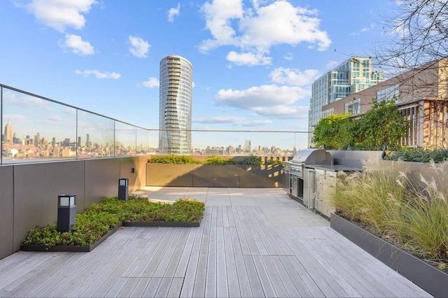 deck featuring a grill and exterior kitchen