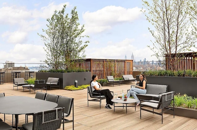 wooden deck featuring an outdoor hangout area