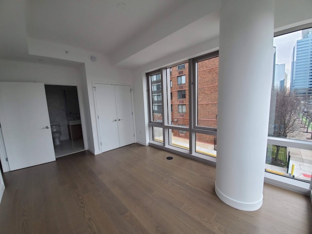 spare room featuring wood finished floors