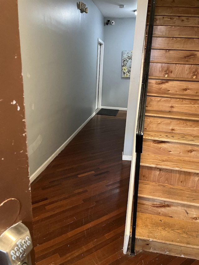 corridor featuring dark hardwood / wood-style flooring