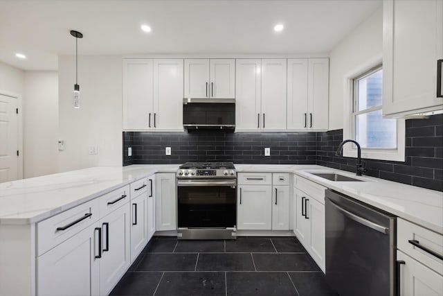 kitchen with a peninsula, hanging light fixtures, stainless steel appliances, white cabinetry, and a sink