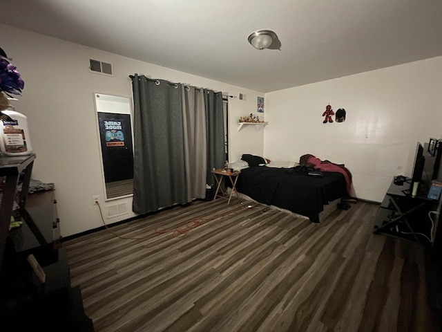 bedroom featuring dark wood-type flooring