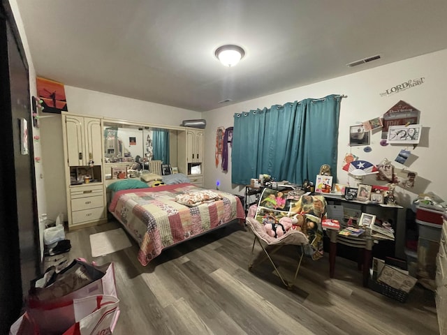 bedroom featuring hardwood / wood-style floors