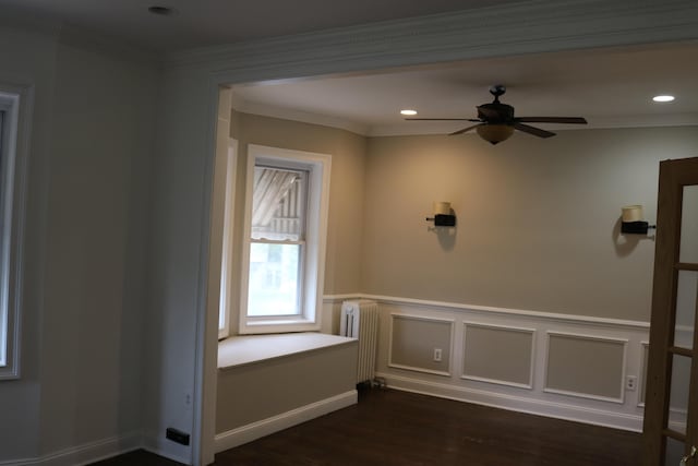 94 Lembeck Ave, Jersey City, NJ 07305 - empty room with dark wood-style flooring, radiator, ceiling fan, a wainscoted wall, and recessed lighting