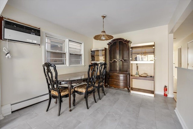 dining space with a baseboard heating unit and a wall unit AC