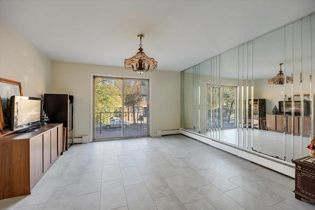 interior space with an inviting chandelier and a baseboard heating unit