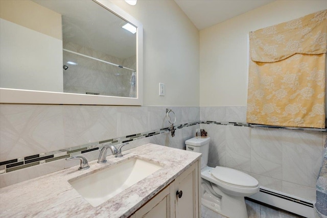 bathroom featuring baseboard heating, vanity, toilet, and tile walls