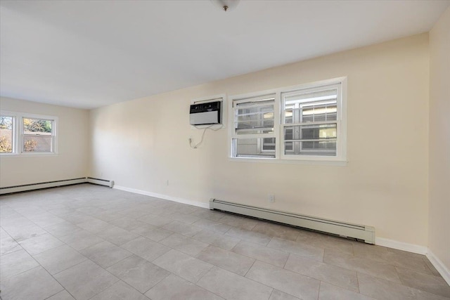 spare room with baseboard heating, light tile patterned flooring, and a wall mounted air conditioner