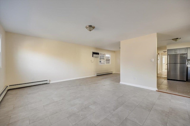 spare room with baseboard heating, a wall unit AC, and light tile patterned floors