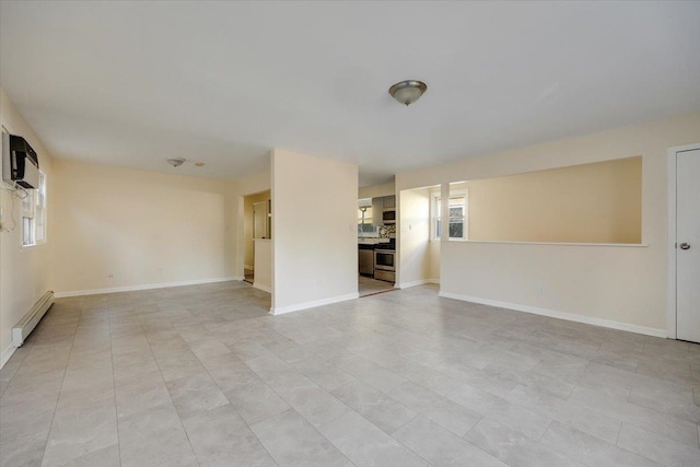 unfurnished living room with a baseboard radiator, light tile patterned floors, and a wall mounted air conditioner