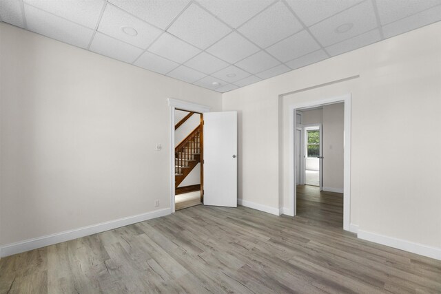 337 70th St, Guttenberg, NJ 07093 - spare room with a paneled ceiling, wood finished floors, baseboards, and stairs