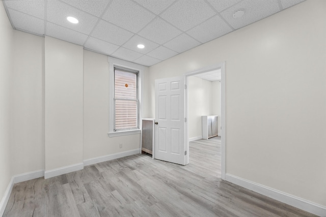 337 70th St, Guttenberg, NJ 07093 - unfurnished room featuring wood finished floors, baseboards, recessed lighting, a paneled ceiling, and a smoke detector